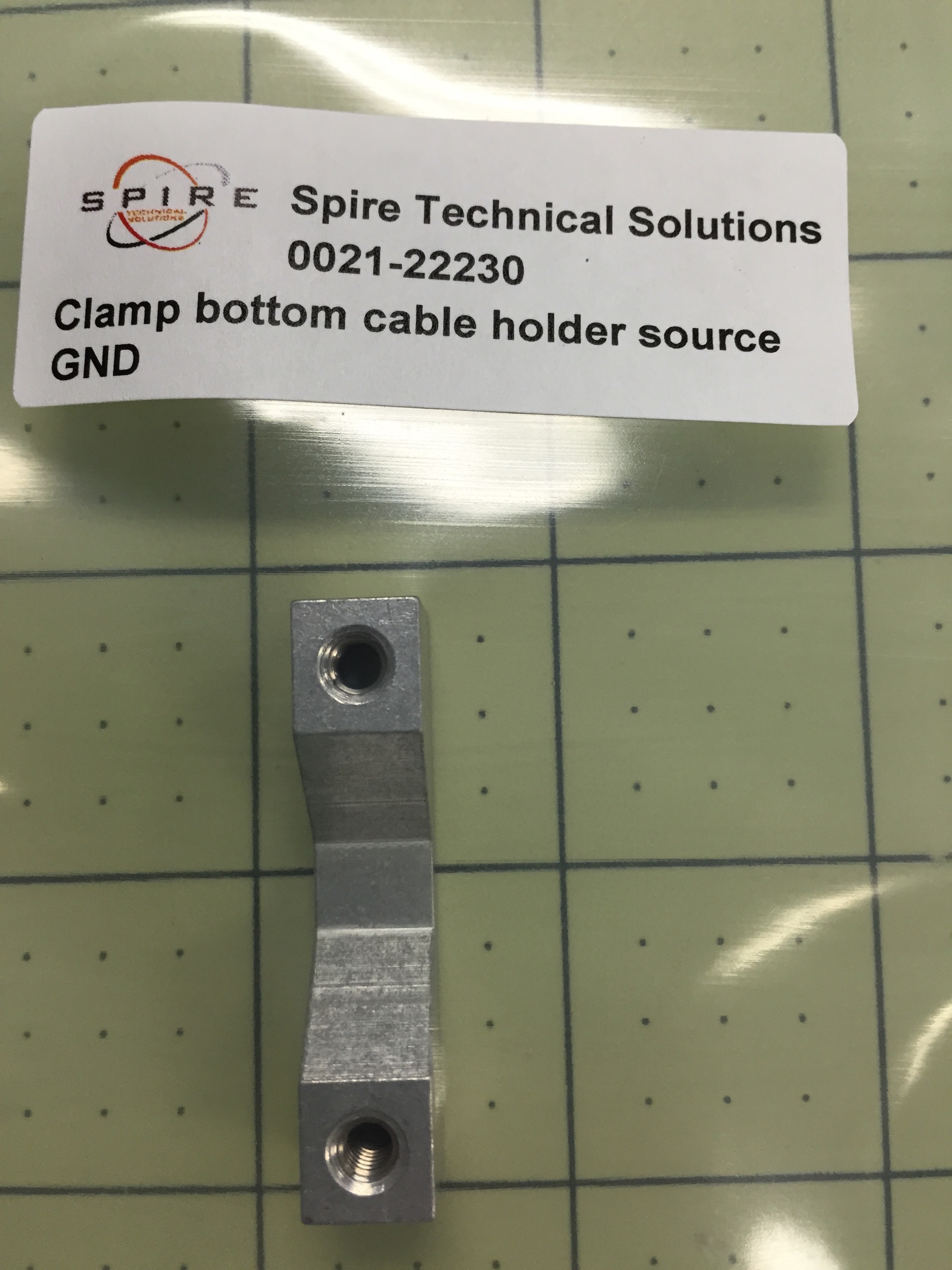 Clamp bottom cable holder source GND